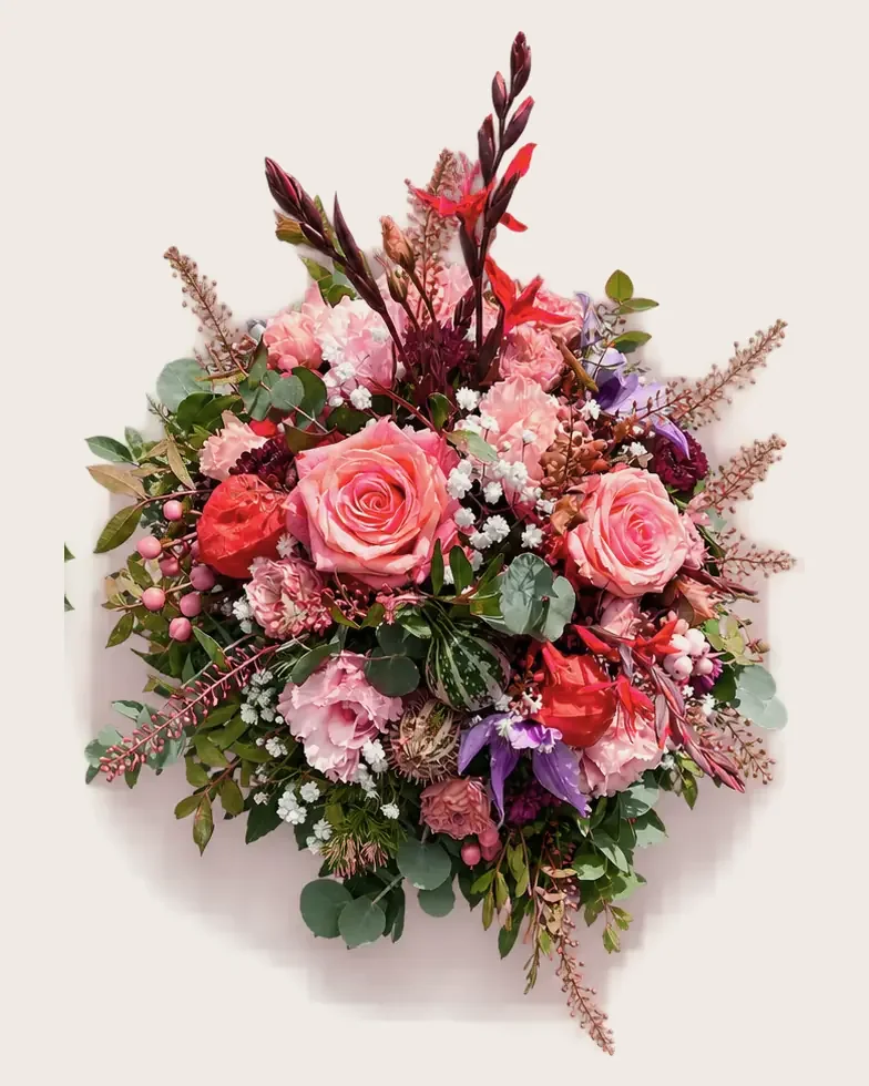 Gesteck mit Gladiolen und Rosen in Rot und Rosa
