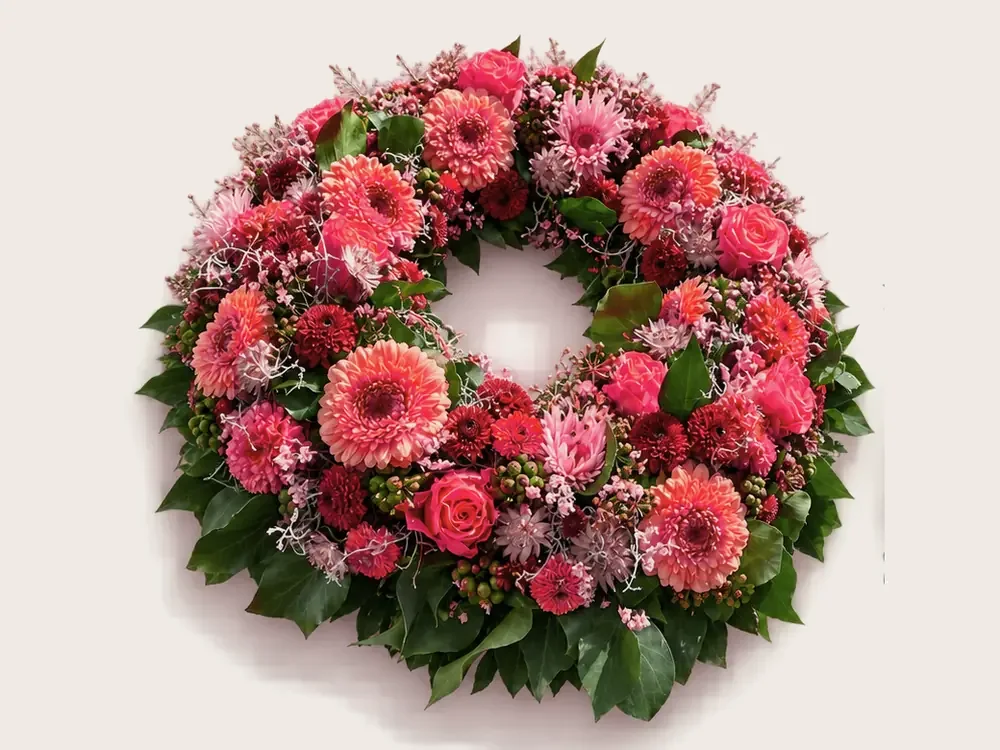 Runder Kranz mit Gerbera in Rot und Rosa